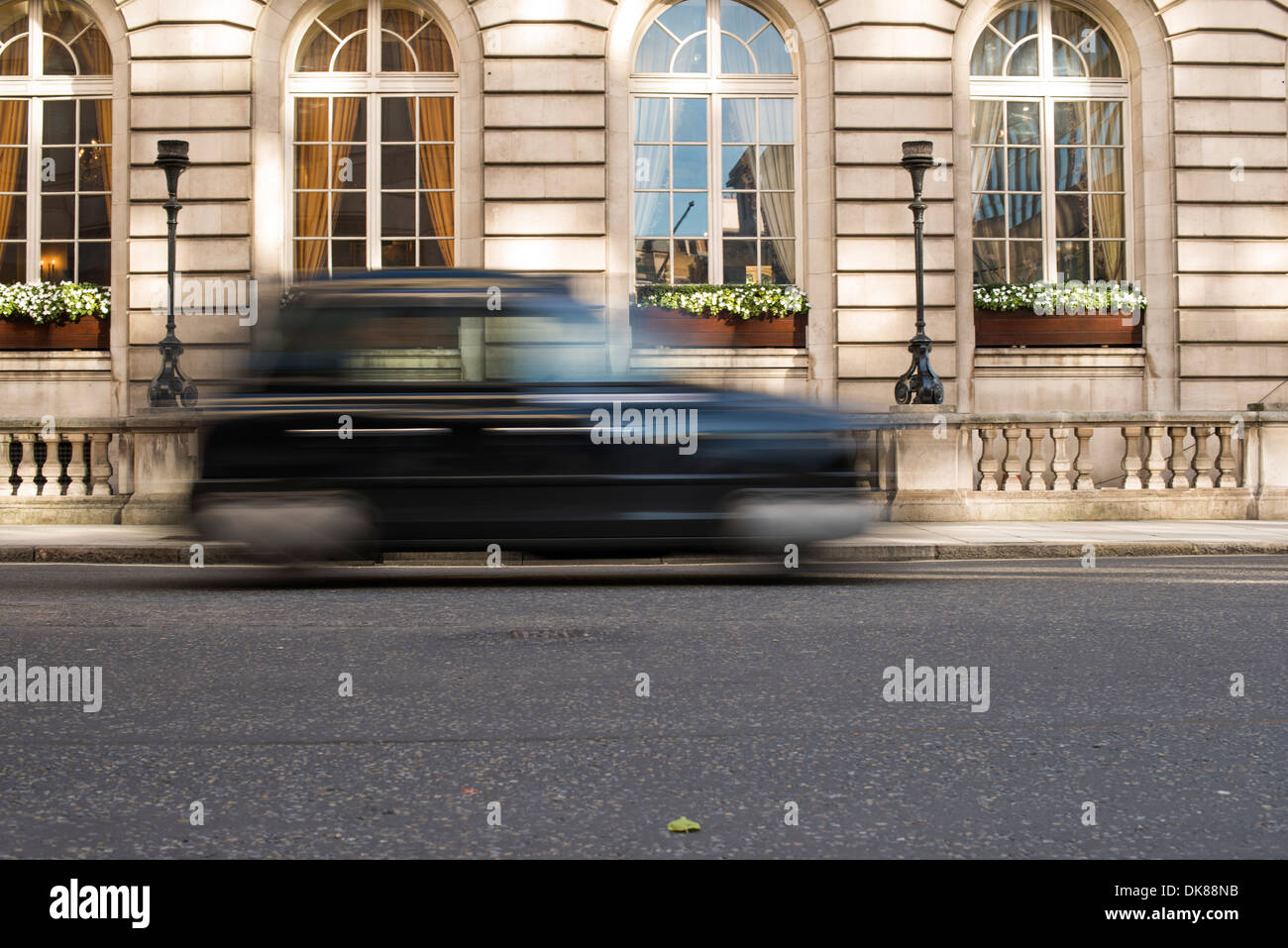 Vintage Taxi in motion in London. Stock Photo