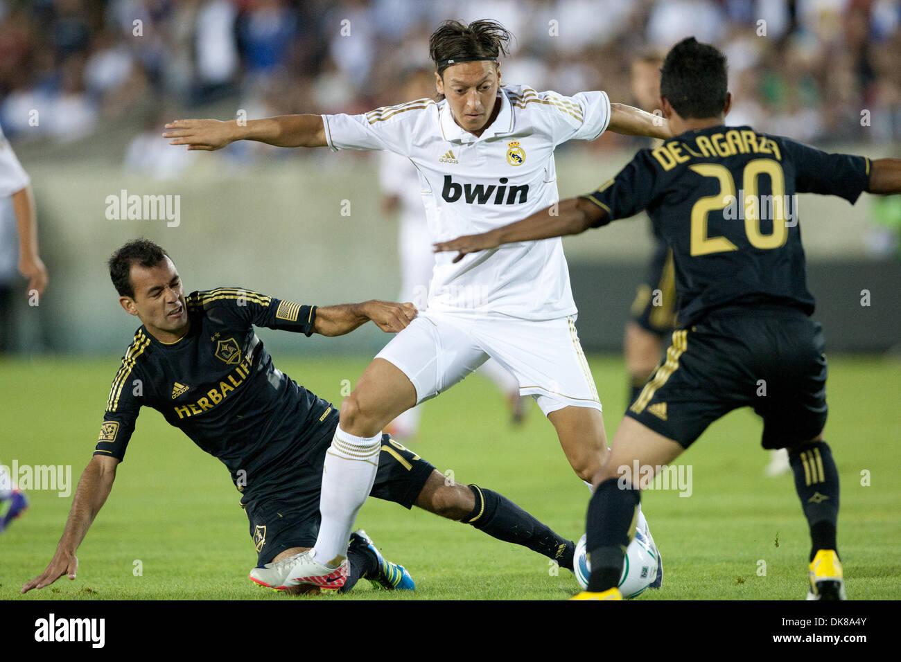 July 16, 2011 - Los Angeles, California, U.S - Real Madrid C.F. midfielder Mesut Ozil #23 tries to beat the Galaxy defense during the World Football Challenge game between La Liga powerhouse Real Madrid and the Los Angeles Galaxy at the Los Angeles Memorial Coliseum. Real Madrid went on to defeat the Galaxy with a final score of 4-1. (Credit Image: © Brandon Parry/Southcreek Global Stock Photo