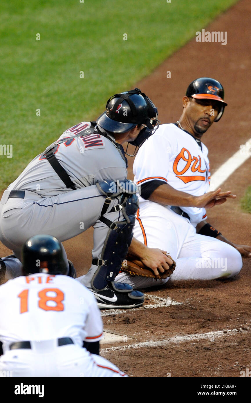 July 16, 2011 - Baltimore, Maryland, U.S - Baltimore Orioles Infielder Derrek Lee  (25) tries to avoid the tag of Cleveland Indians Catcher Lou Marson  (6) but would be out on the play during a game between the Cleveland Indians and the Baltimore Orioles, the Orioles defeated the Indians 6-5 (Credit Image: © TJ Root/Southcreek Global/ZUMApress.com) Stock Photo