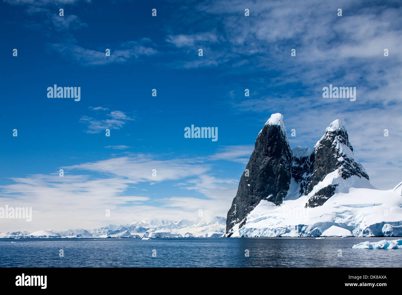 Antarctica, Mountain peaks rise above Cape Renard at entrance to ...