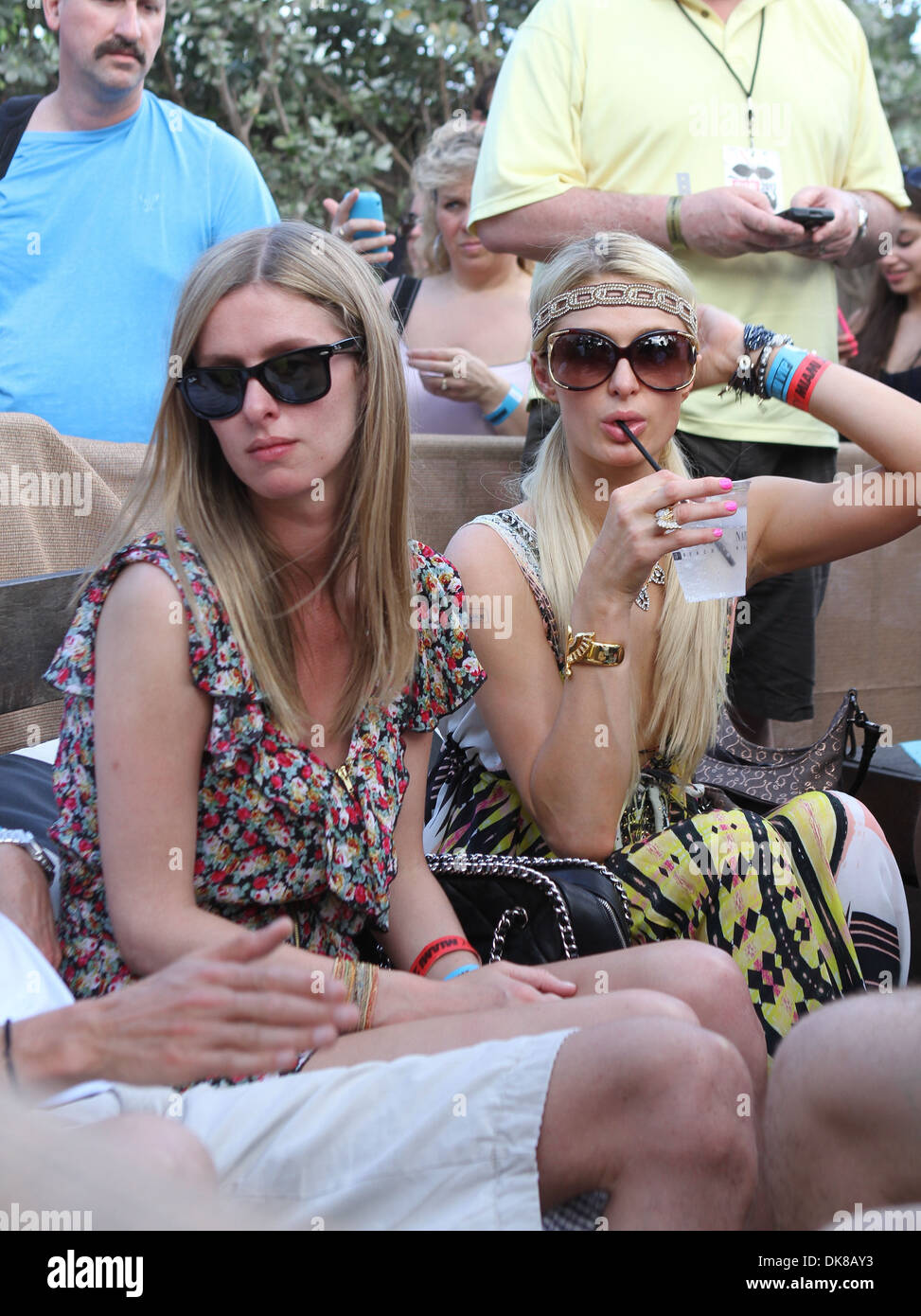 Paris Hilton wearing a colorful bikini top attends her boyfriend DJ