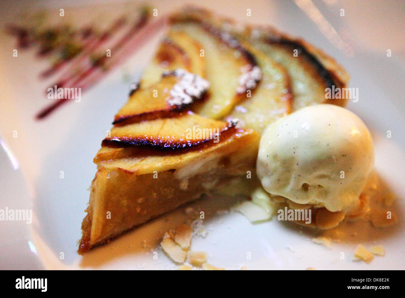 Apple pie served with vanilla ice cream. Stock Photo