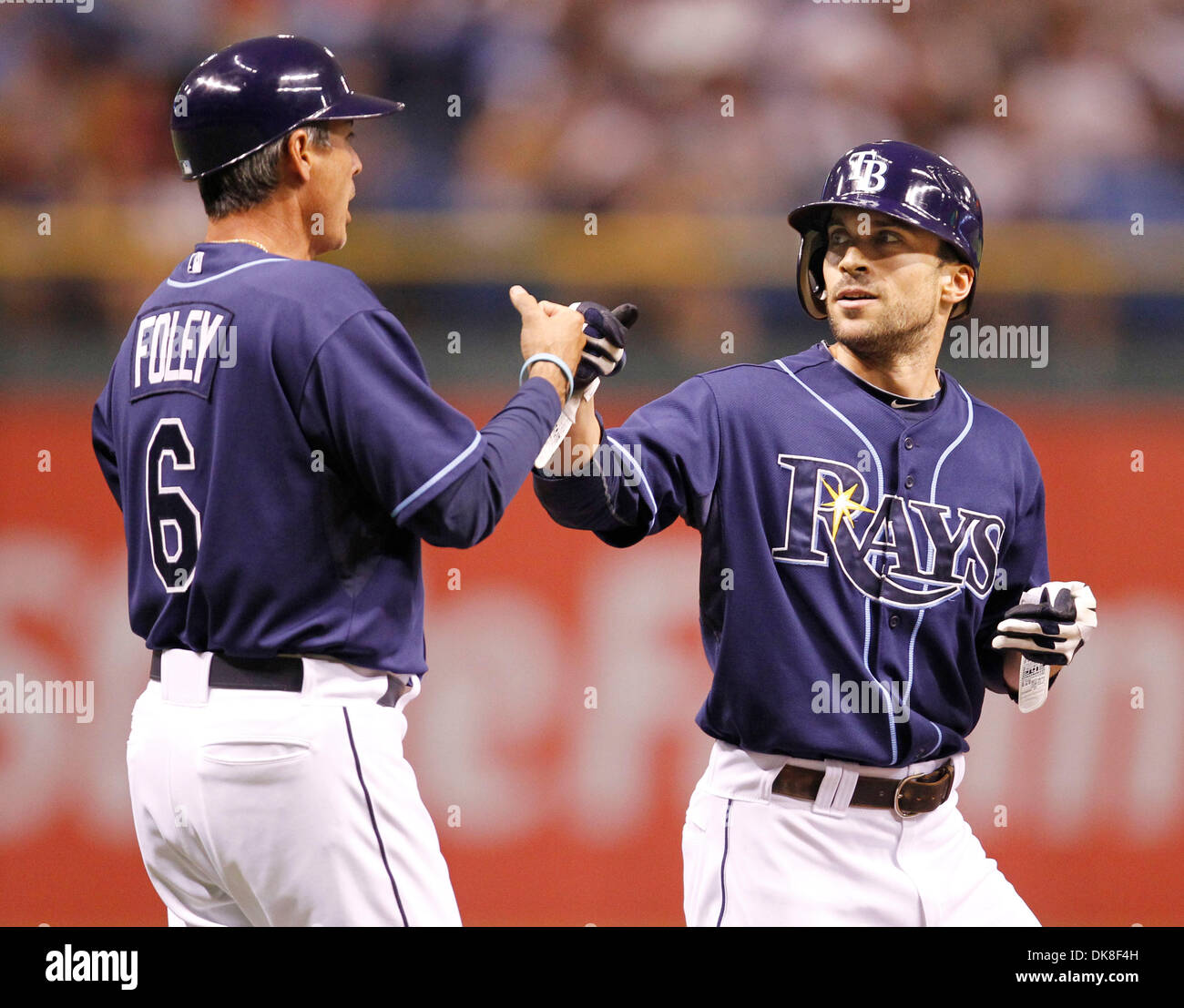 July 21, 2011 - St. Petersburg, Florida, U.S. - Third Base Coach TOM FOLEY congratulates SAM FULD on his RBI triple in the fifth which gave the Rays a 2-0 lead over the New York Yankees at Tropicana Field. (Credit Image: © James Borchuck/St. Petersburg Times/ZUMAPRESS.com) Stock Photo