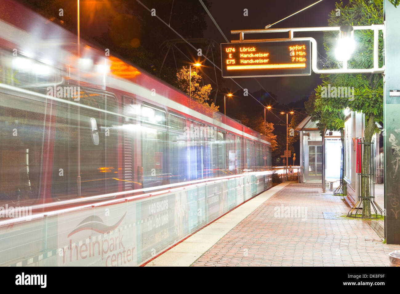 A metro train passes through s a station in Dusseldorf. Stock Photo