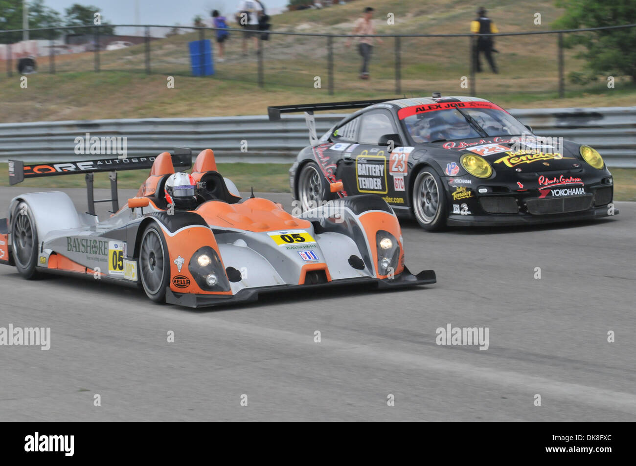 July 22, 2011 - Bowmanville, Ontario, Canada - The #05 CORE Autosport Bayshore Recycling/ Composite Resources Oreca FLM09 passes the #23 Alex Job Racing Battery Tender/ Robert Graham/ William Rast Porsche 911 GT3 Cup during practice for the ALMS race at Mosport. The Mobil 1 Grand Prix of Mosport is held at the Mosport International Raceway in Bowmanville Ontario. (Credit Image: © K Stock Photo