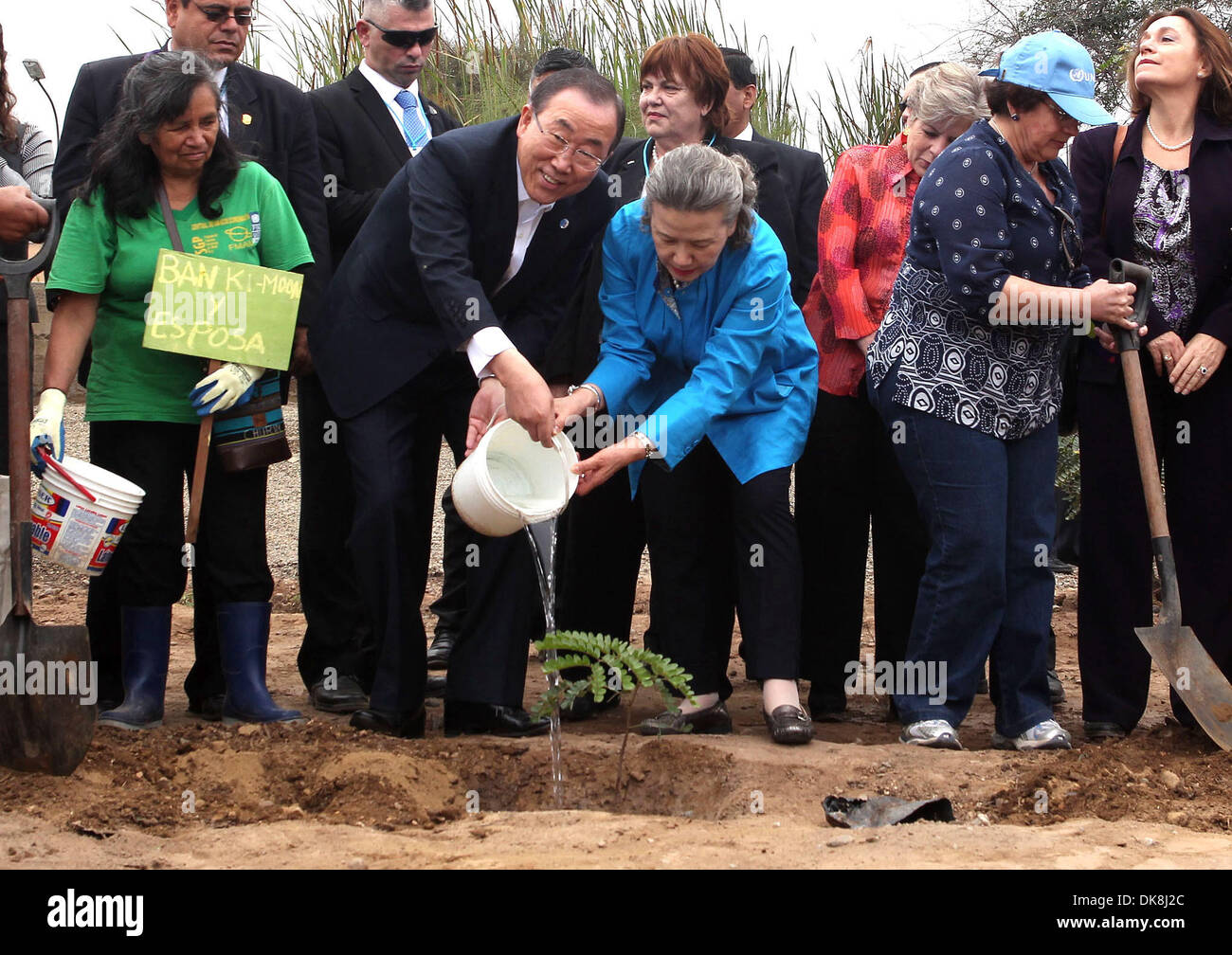 Lima, Peru. 3rd Dec, 2013. United Nations Secretary General Ban Ki-moon and his wife Yoo Soon-taek plant a tree during their visit to a reforestation project in the El Agustino district of Lima, capita of Peru, on Dec. 3, 2013. Ban Ki-moon is on visit to Lima to attend the 15th Session of the United Nations Industrial Development Organization (UNIDO) General Conference meeting that ends on Dec. 6. Credit:  Vidal Tarqui/Xinhua/Alamy Live News Stock Photo