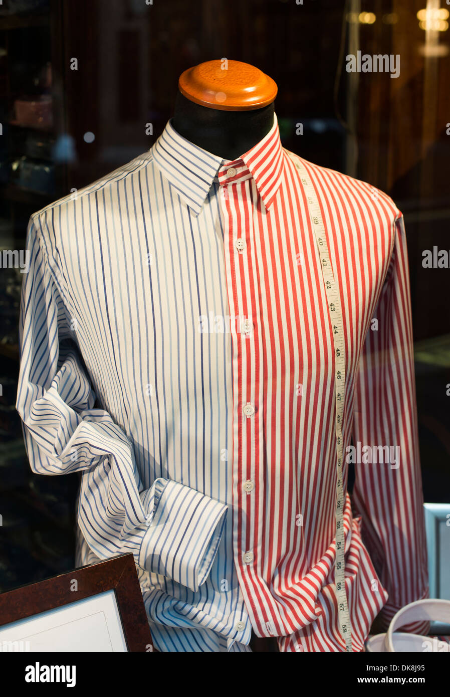 Dummy and shirt in a store. Sewing tape measure Stock Photo