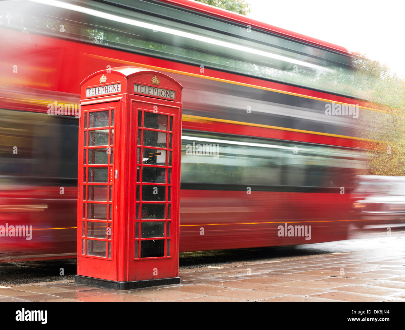 Red Phone cabine and bus in London. Vintage phone cabine monumental Stock Photo