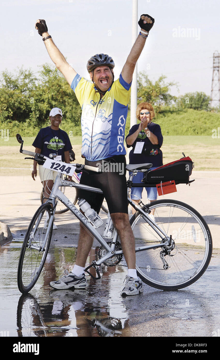 July 30, 2011 - Iowa, U.S. - Bradley Sutlift of Davenport raises his hand after reaching the end of the RAGBRAI ride Saturday July 30, 2011. (Credit Image: © Kevin E. Schmidt/Quad-City Times/ZUMAPRESS.com) Stock Photo