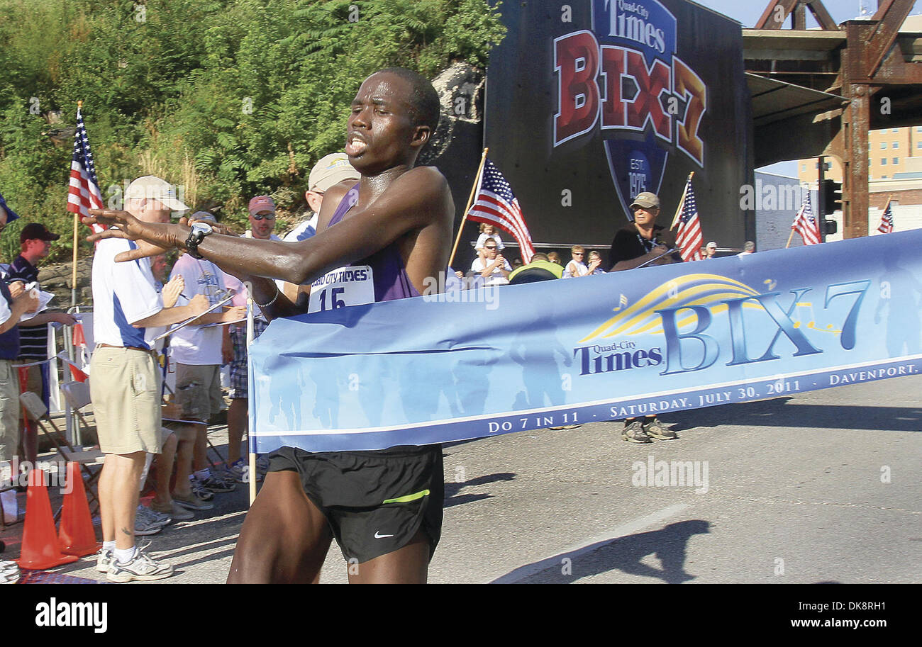 July 30, 2011 - Colona, Iowa, U.S. - Silas Kipruto from Kenya, breaks the tape as he crosses the finish line, Sat. July 30, 2011, during the Quad-City Times Bix 7 road race. He finished in a time of :32.36. (Credit Image: © John Schultz/Quad-City Times/ZUMAPRESS.com) Stock Photo