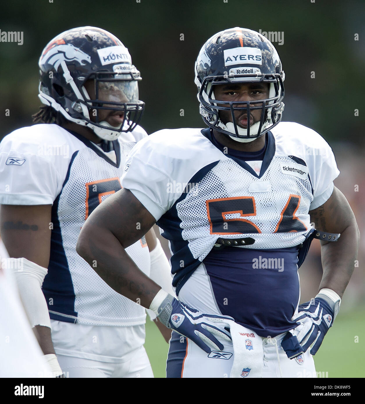 July 31, 2011 - Centennial, Colorado, U.S. - DE ROBERT AYERS, right, awaits instructions before the next defensive drills commence  during the Denver Broncos Training Camp Sunday afternoon at Dove Valley in Centennial, Colorado.  (Credit Image: © Hector Acevedo/ZUMAPRESS.com) Stock Photo