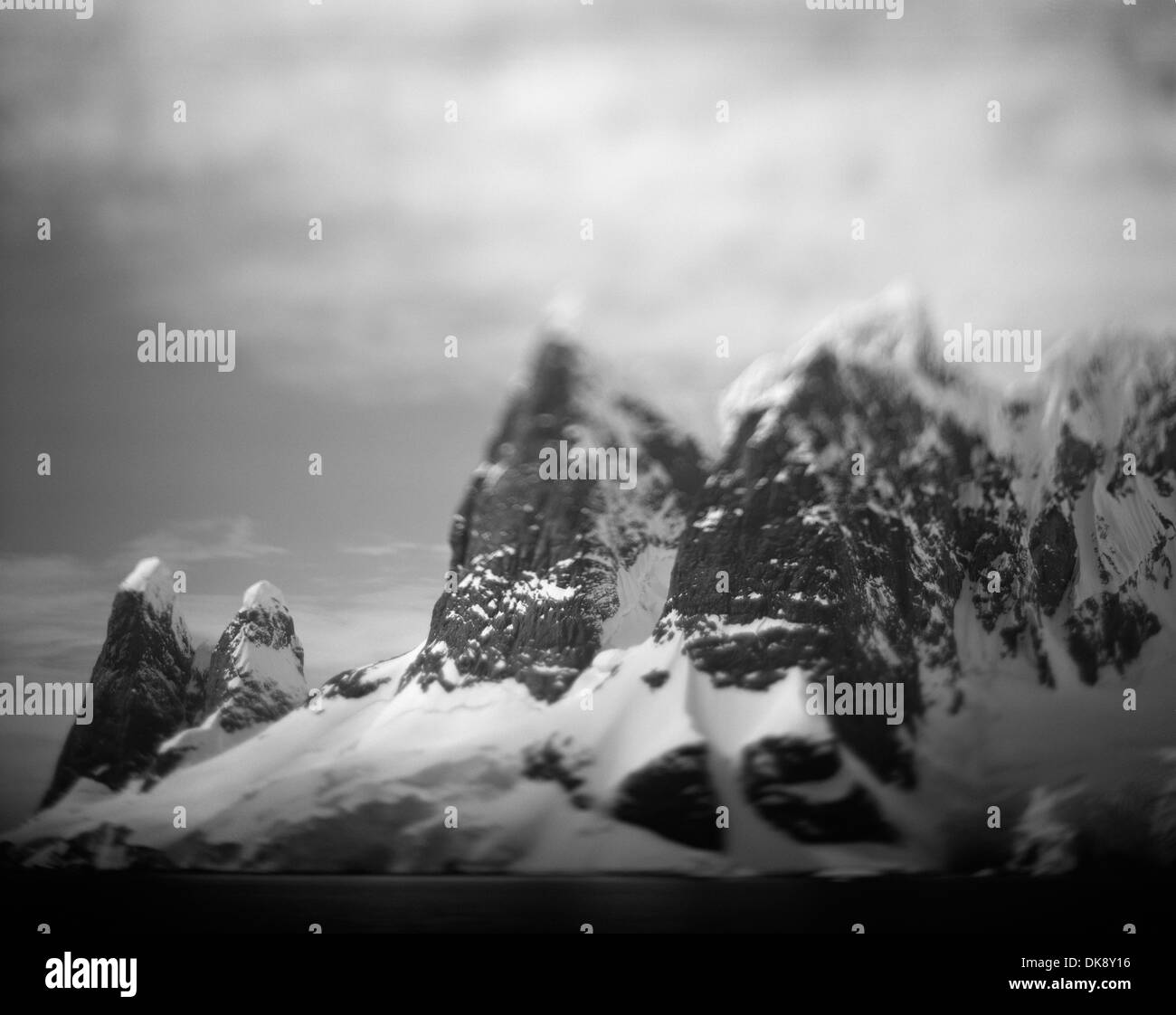 Antarctica, Blurred color image of mountain peaks along Cape Renaud in Lemaire Channel in spring sunshine Stock Photo