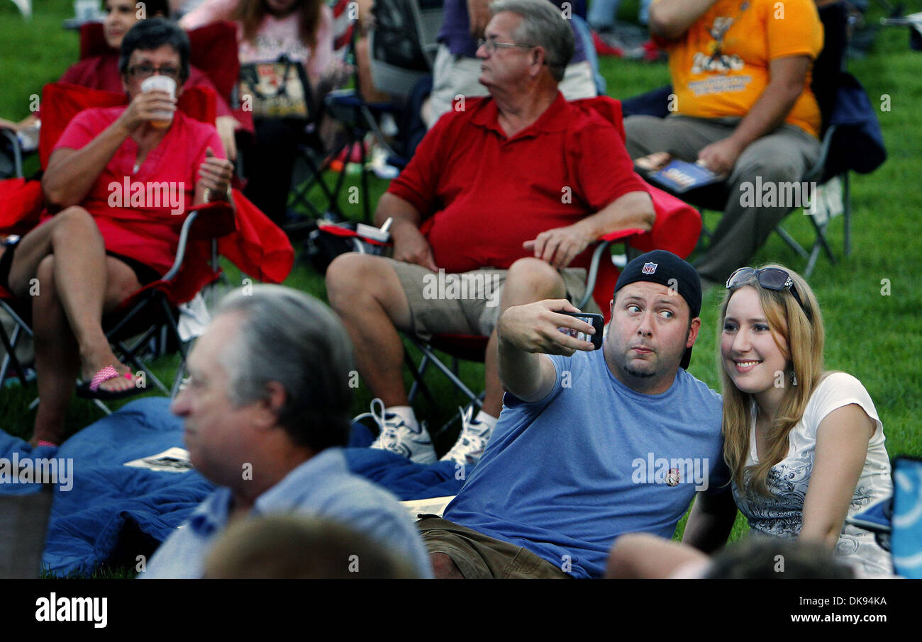 Aug. 9, 2011 - Memphis, Tn, U.S. - August 9, 2011 - Shane McCrea (left) makes a funny face as he strikes a pose while taking a picture with friend Jamie Hanskiewicz (cq) (right) during the Rock 'n' Roll Anniversary Concert at Levitt Shell in Overton Park Tuesday evening. Hundreds gather at for the special kick-off event for Elvis Week that commemorates a performance by Elvis Presle Stock Photo