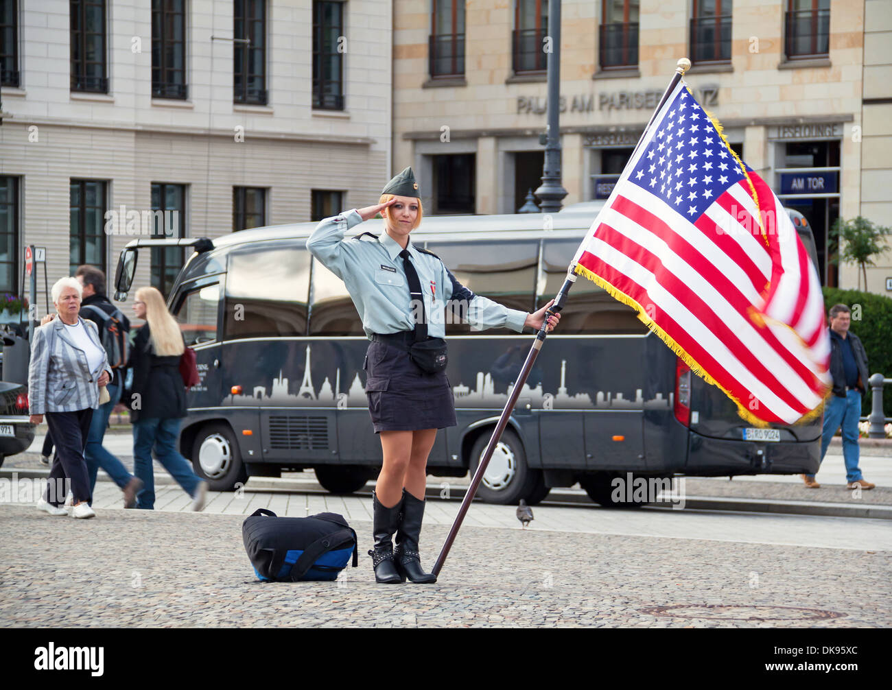 BERLIN, GERMANY - MAY 18, 2009: cute young woman with an American flag on the street of Berlin on May 18, 2009. Stock Photo