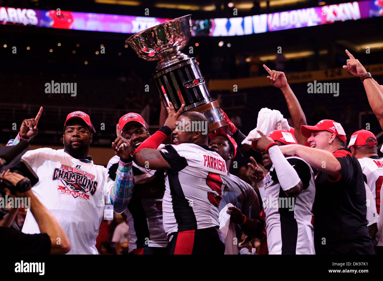 august 12, 2011: the jacksonville sharks hold up the afl trophy