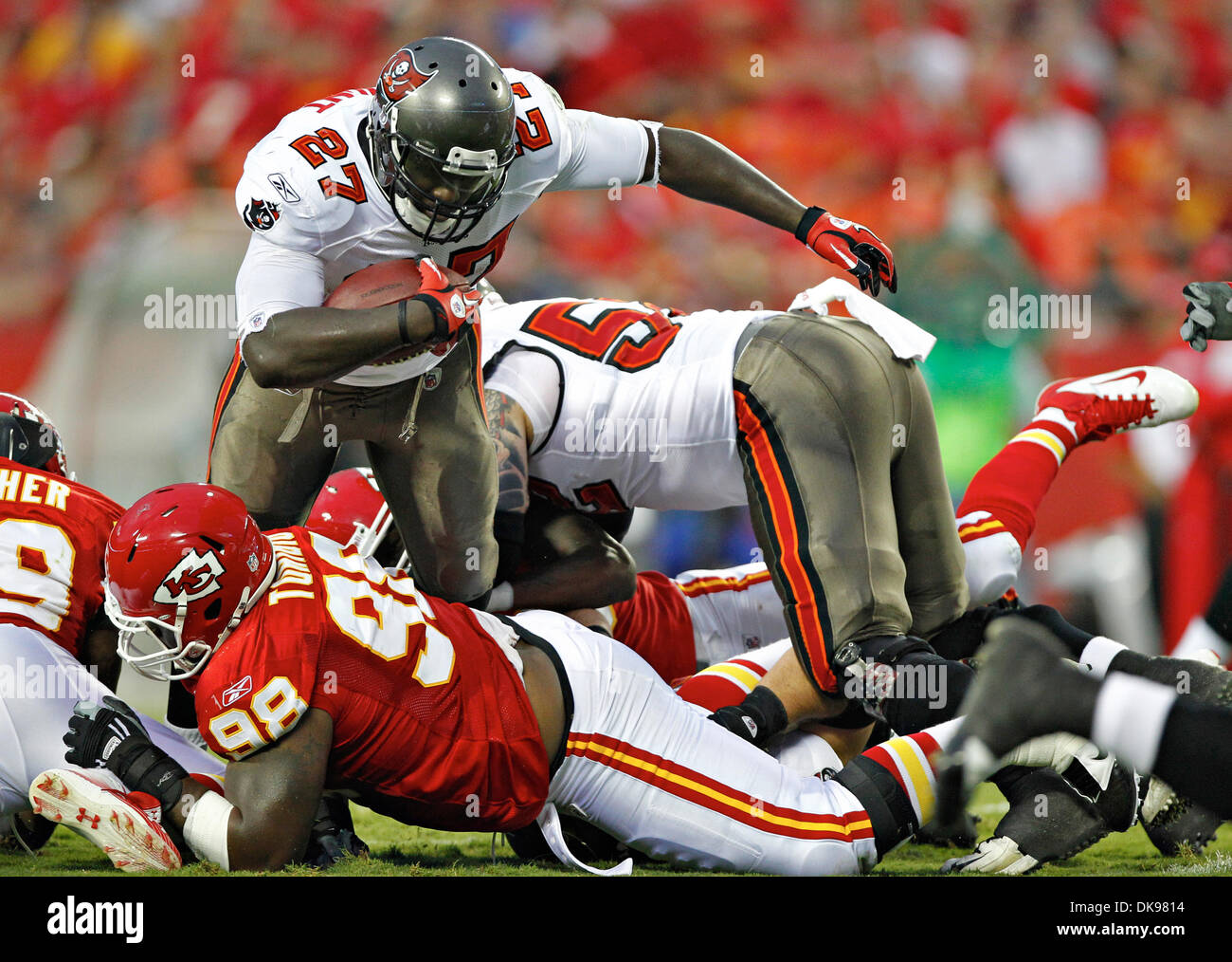 Aug. 12, 2011 - DANIEL WALLACE   |   Times.OT 341695 WALL Bucs 5 (08/12/2011 Kansas City, Mo.) Tampa Bay Buccaneers running back LeGarrette Blount (27) goes up the middle for three yards during the first quarter, tripped up by Kansas City Chiefs defensive tackle Anthony Toribio (98). FIRST HALF ACTION: The Tampa Bay Buccaneers play the Kansas City Chiefs at Arrowhead Stadium in Kan Stock Photo