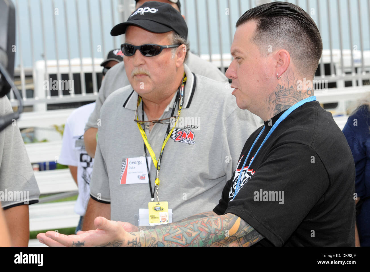 Aug. 13, 2011 - Watkins Glen, New York, U.S - West Custom's owner Ryan Friedlinghaus (right) show's off the Jeep that was custom made for Zippo to Zippo owner/chairman George Duke