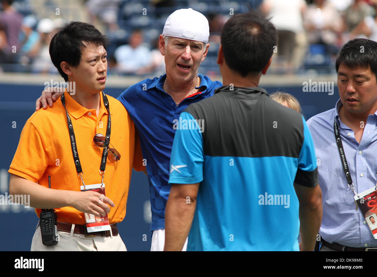 Aug. 13, 2011 - Toronto, Ontario, Canada - USA's legend John McEnroe with court doctors after his upper leg injury forces him out of the match at the Rogers Cup, played at the Rexall Centre in Toronto. Chan was leading when McEnroe was injured. (Credit Image: Â© Steve Dormer/Southcreek Global/ZUMAPRESS.com) Stock Photo