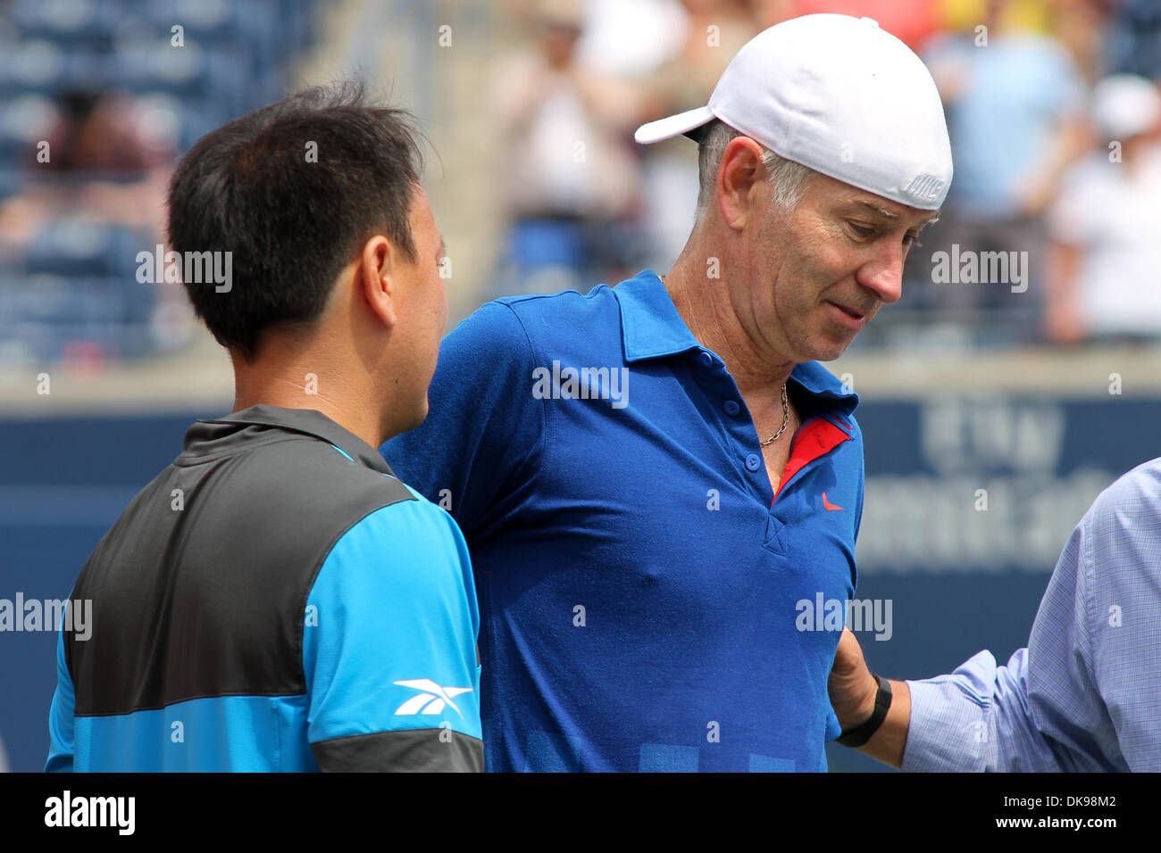 Aug. 13, 2011 - Toronto, Ontario, Canada - USA's legend John McEnroe with court doctors after his upper leg injury forces him out of the match at the Rogers Cup, played at the Rexall Centre in Toronto. Chan was leading when McEnroe was injured. (Credit Image: © Steve Dormer/Southcreek Global/ZUMAPRESS.com) Stock Photo