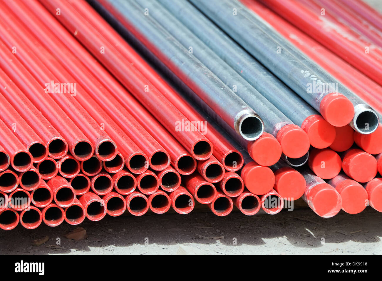 Stack of metallic pipes in a construction site Stock Photo - Alamy