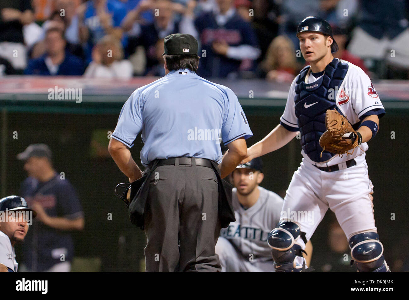 Aug. 22, 2011 - Cleveland, Ohio, U.S - Cleveland catcher Lou Marson (6) argues with with home plate umpire Phil Cuzzi (10) after Cuzzi called a runner safe at the plate during the ninth inning.  The Seattle Mariners defeated the Cleveland Indians 3-2 at Progressive Field in Cleveland, Ohio. (Credit Image: © Frank Jansky/Southcreek Global/ZUMAPRESS.com) Stock Photo