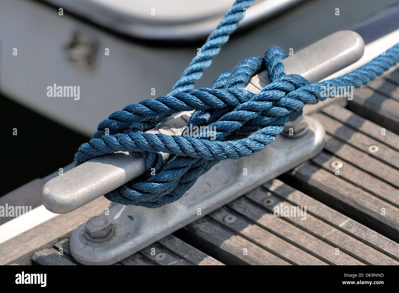 Close-up of a jetty bitt with tied up rope Stock Photo - Alamy