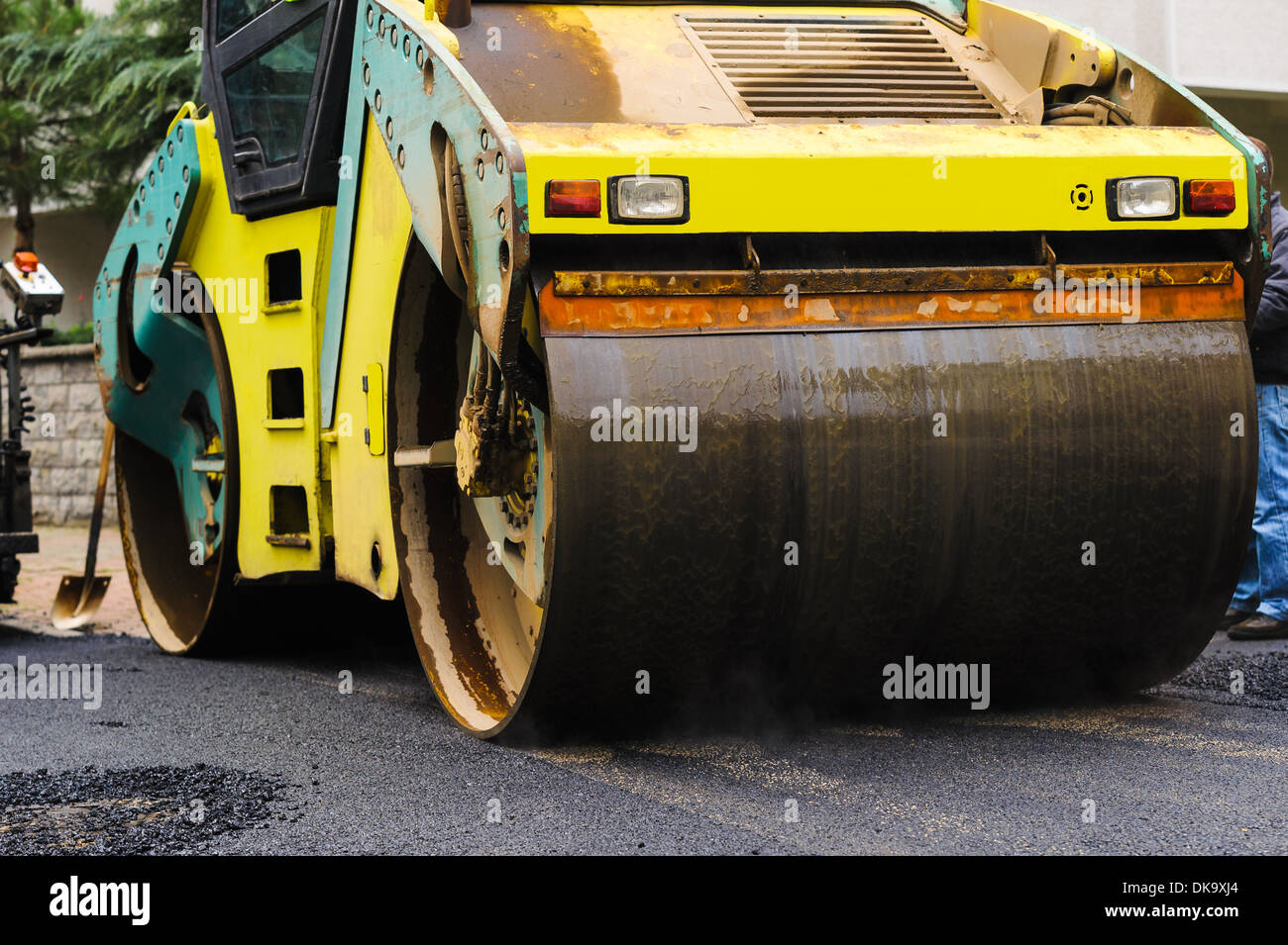 steamroller big size flatten out the asphalt Stock Photo