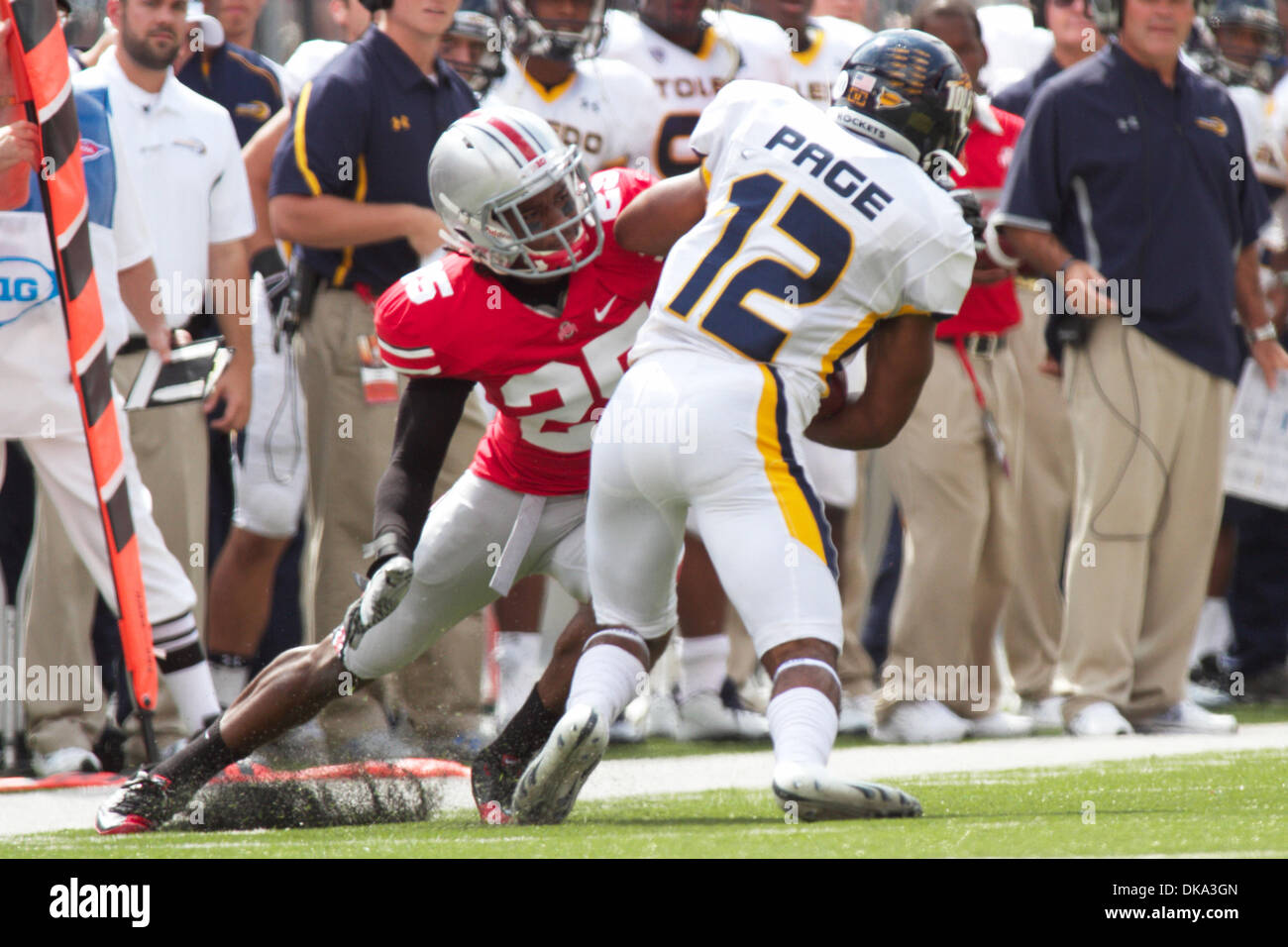 Sept. 10, 2011 - Columbus, Ohio, U.S - Ohio State Buckeyes defensive back Bradley Roby (25) wraps up Toledo Rockets wide receiver Eric Page (12) after a pass during the first quarter of the game between Toledo and Ohio State at Ohio Stadium, Columbus, Ohio. Ohio State defeated Toledo 27-22. (Credit Image: © Scott Stuart/Southcreek Global/ZUMAPRESS.com) Stock Photo