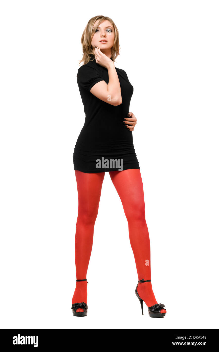 Attractive young woman in a black dress and red tights Stock Photo - Alamy