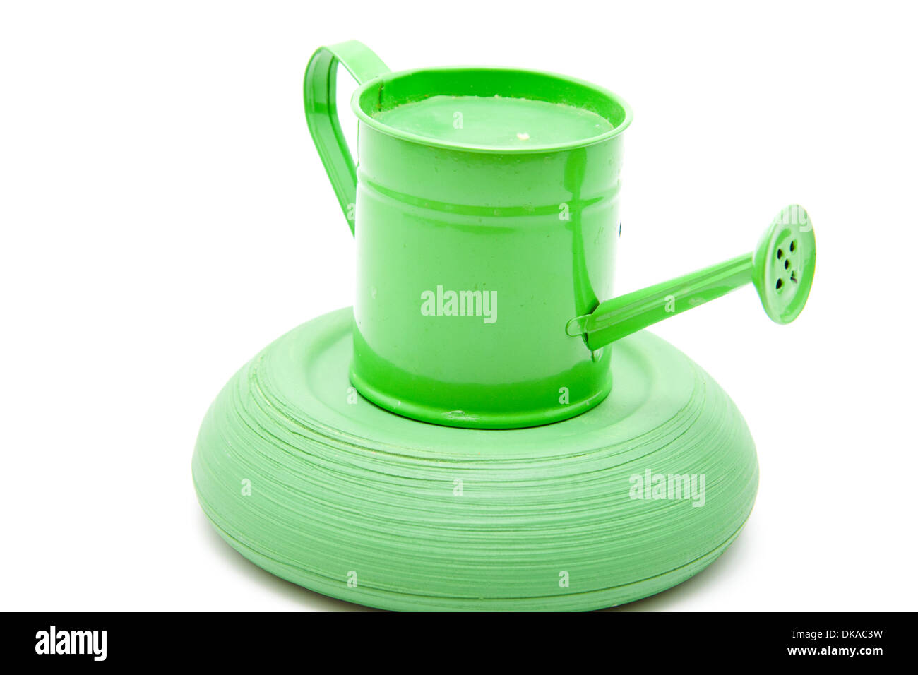 Watering can with stone bowl Stock Photo Alamy