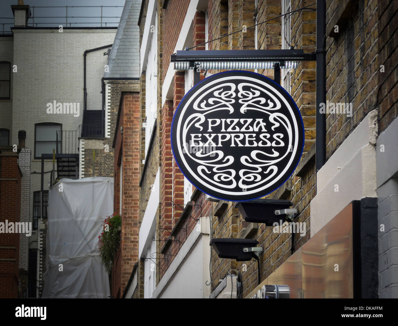 PIZZA EXPRESS sign above restaurant in Bruton Place Berkeley Square London UK Stock Photo