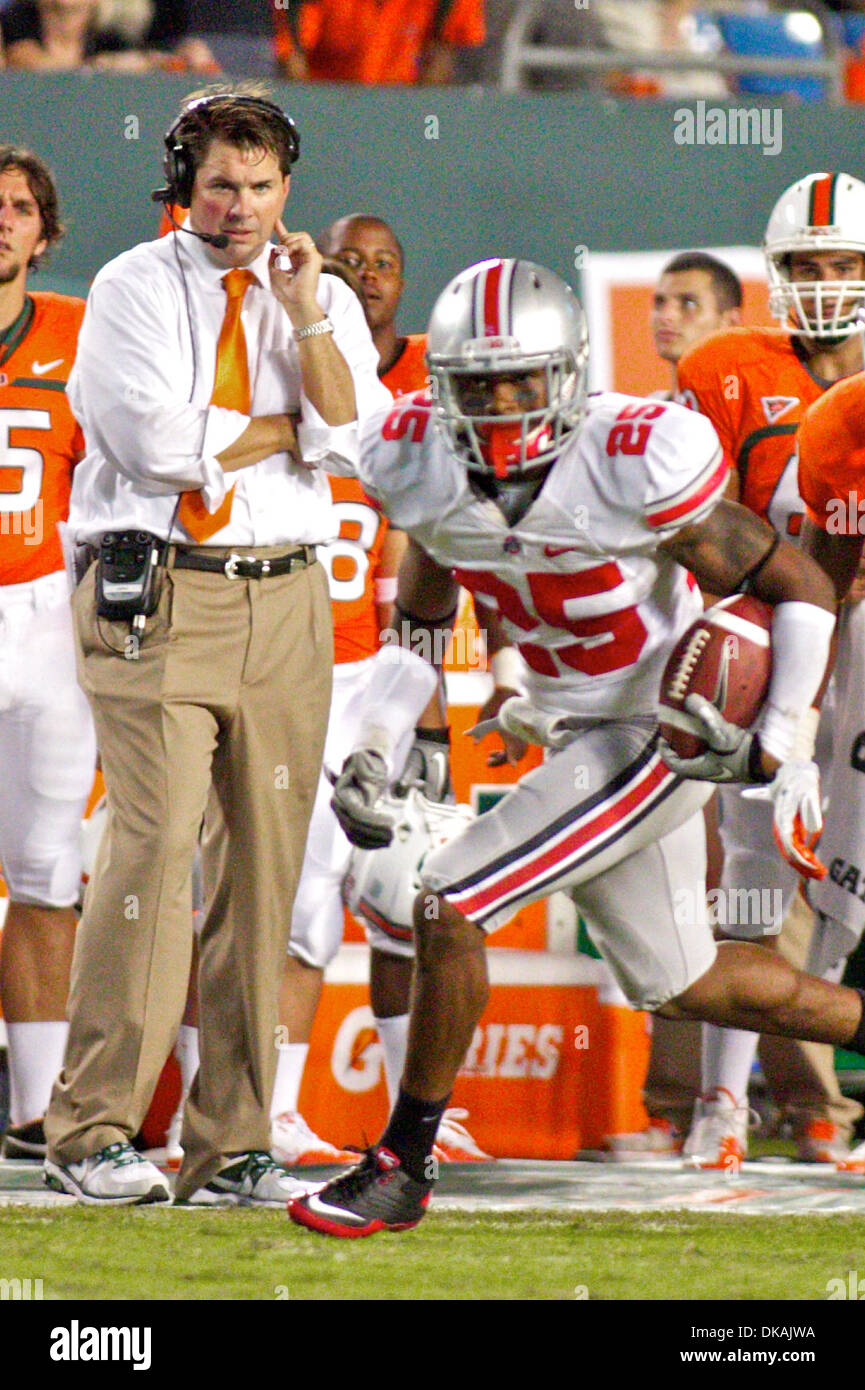 Sept. 17, 2011 - Miami, Florida, U.S - Miami Hurricanes head coach Al Golden watches closely as Ohio State Buckeyes defensive back Bradley Roby (25) runs back an interception in the second quarter of the game between Ohio State and Miami at Sun Life Stadium, Miami, Florida.  Miami defeated Ohio State 24-6. (Credit Image: © Scott Stuart/Southcreek Global/ZUMAPRESS.com) Stock Photo