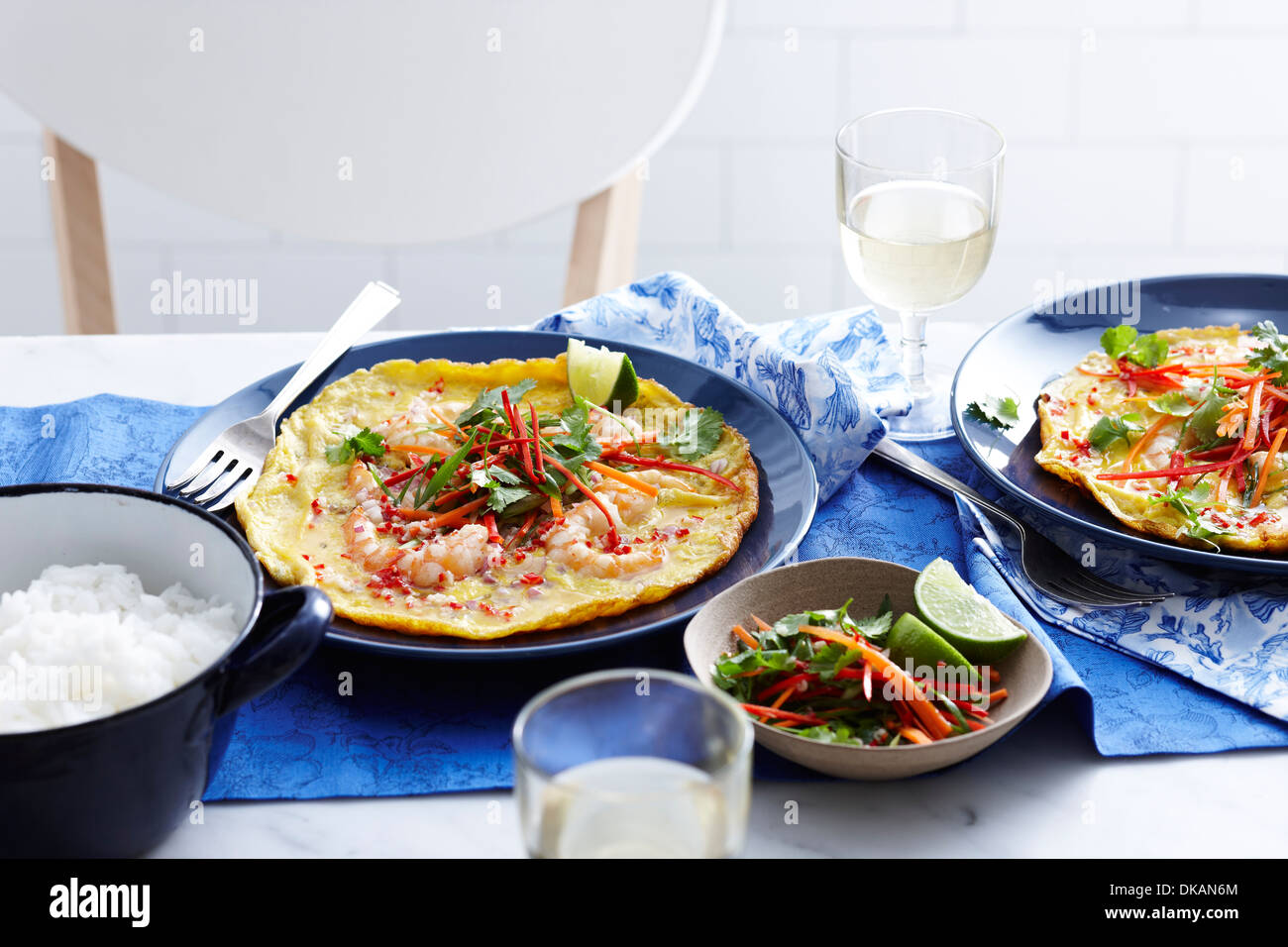 Meal with vietnamese prawn omelette and salad Stock Photo