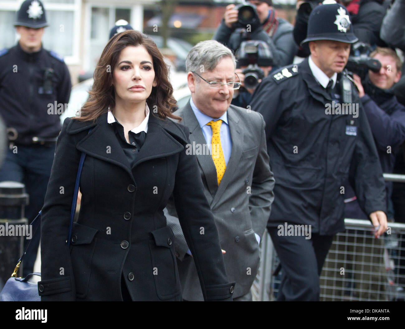 London, UK. 4th December 2013. TV chef Nigella Lawson arrives at Isleworth Crown Court in west London to give evidence in the trial of Elisabetta, 41, and co-defendant Francesca, 35, both  former aides of Ms Lawson and accused  with committing fraud against Charles Saatchi, which is said to have taken place between January 2008 and last December .Ms Lawson, 53, wearing a long dark coat, was greeted by dozens of photographers and television crews waiting outside Isleworth Crown Court in west London as she arrived this morning. Credit:  Jeff Gilbert/Alamy Live News Stock Photo