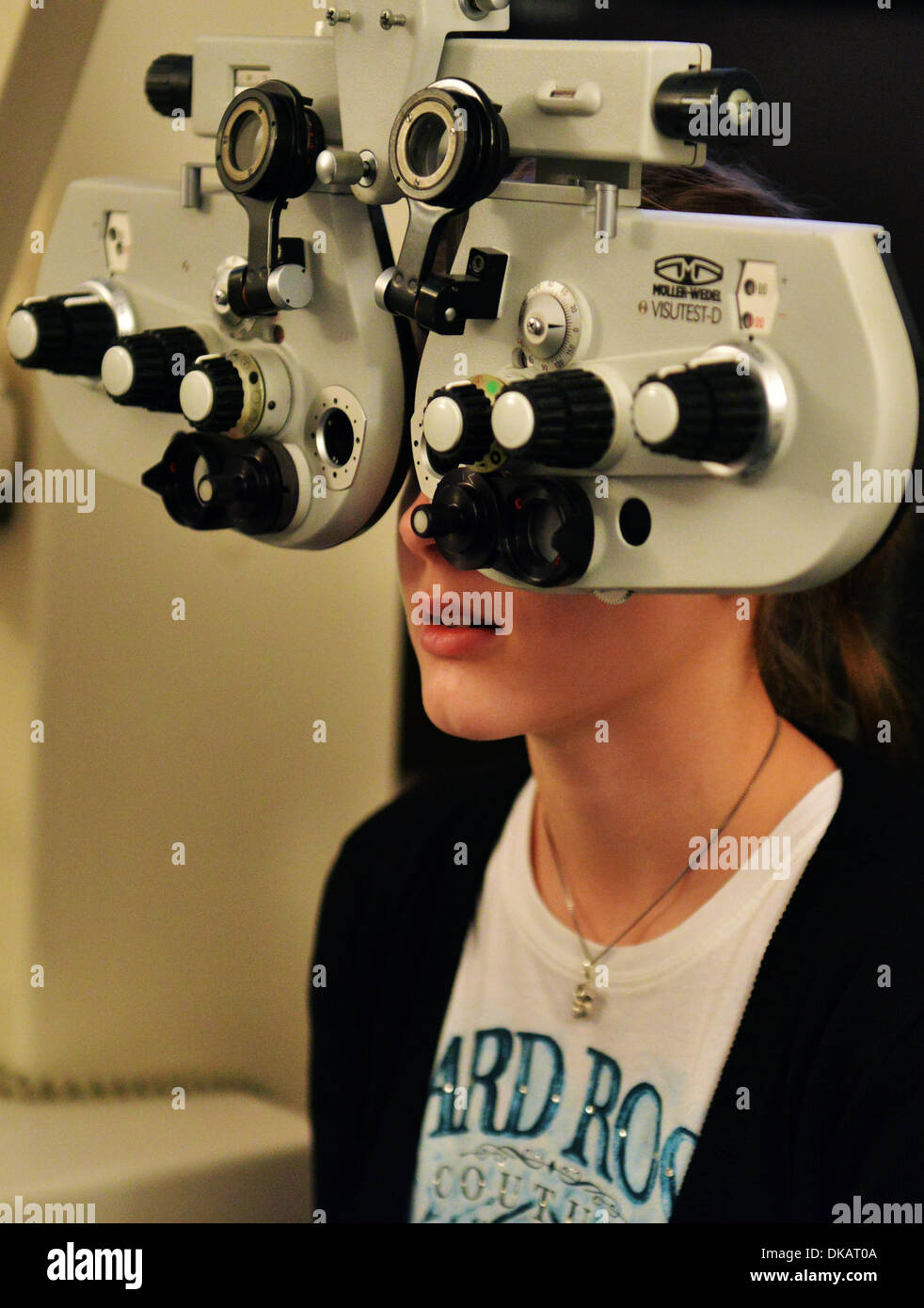 Is dedicated to the modern technology specialist for ophthalmology in his practice of the disease of the eye and the pension had been with his often very young and older patients |. Stock Photo