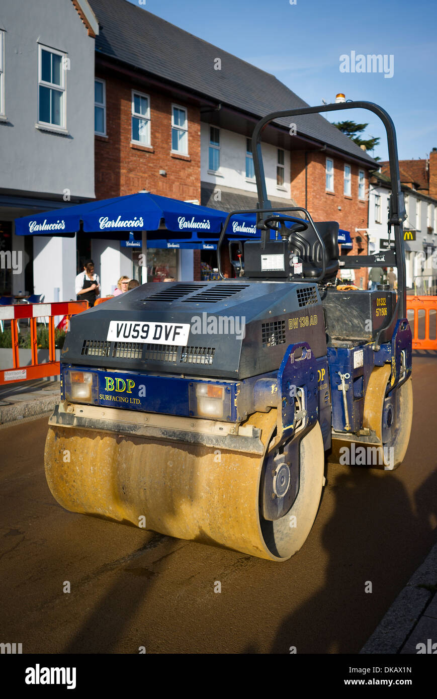 Road roller engaged in resurfacing a road in Stratford Upon Avon UK Stock Photo