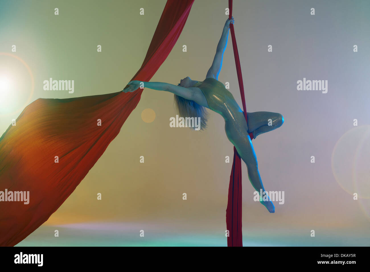 Aerial dancer with red ribbon Stock Photo - Alamy