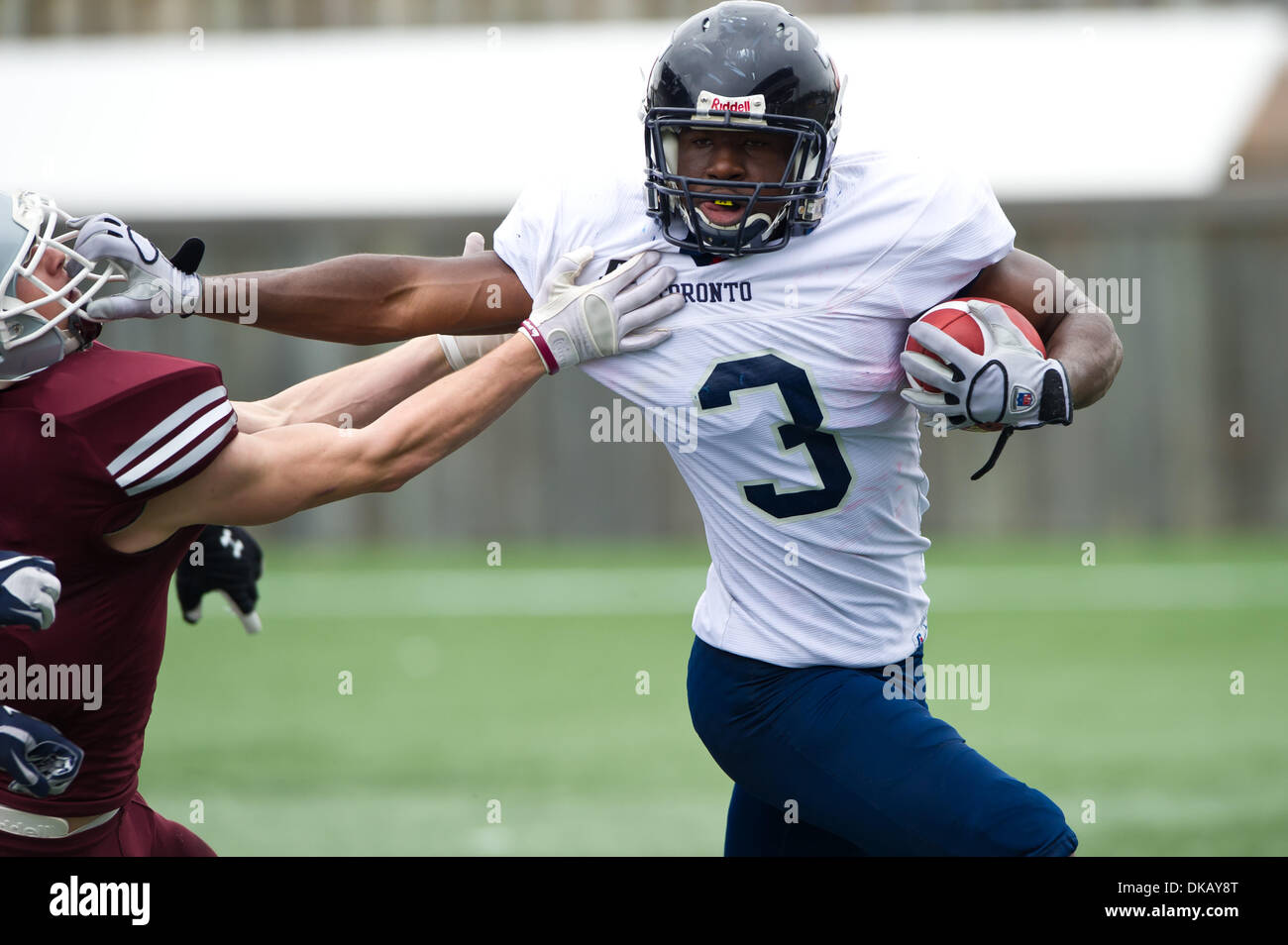 Sept. 24, 2011 - Ottawa, Ontario, Canada - Varsity Blues PDB Donan Munroe (3)  tries to get away from Ottawa Gee-Gees LB John Beck (17), Toronto lost to Ottawa by a score of 41-0 (Credit Image: © Marc DesRosiers/Southcreek Global/ZUMAPRESS.com) Stock Photo