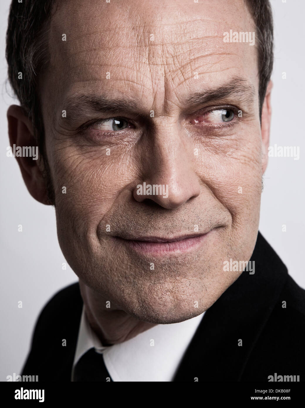 Close up of businessman looking sinister Stock Photo