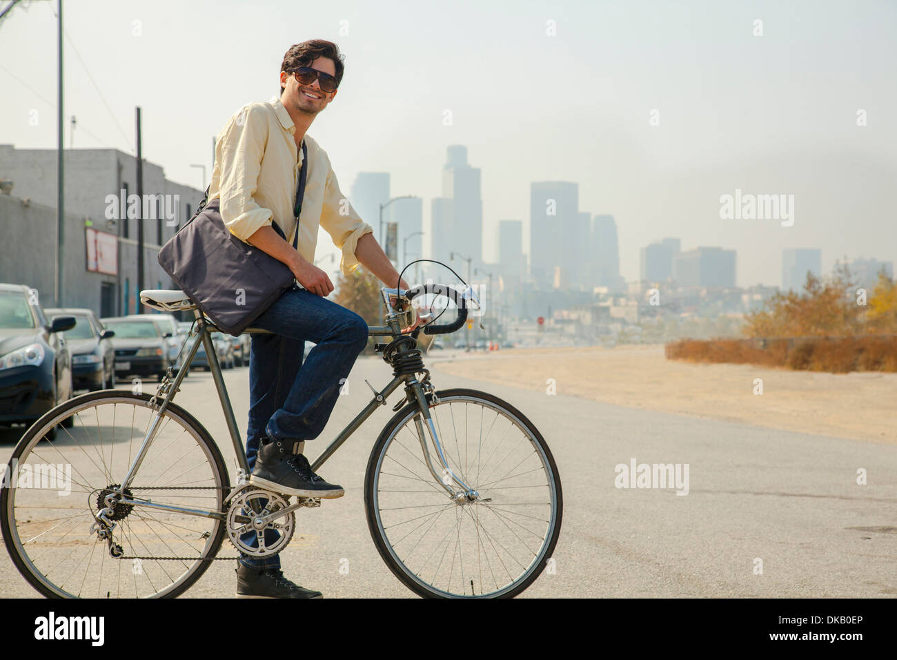 Young man on cycle, Los Angeles, California, USA Stock Photo