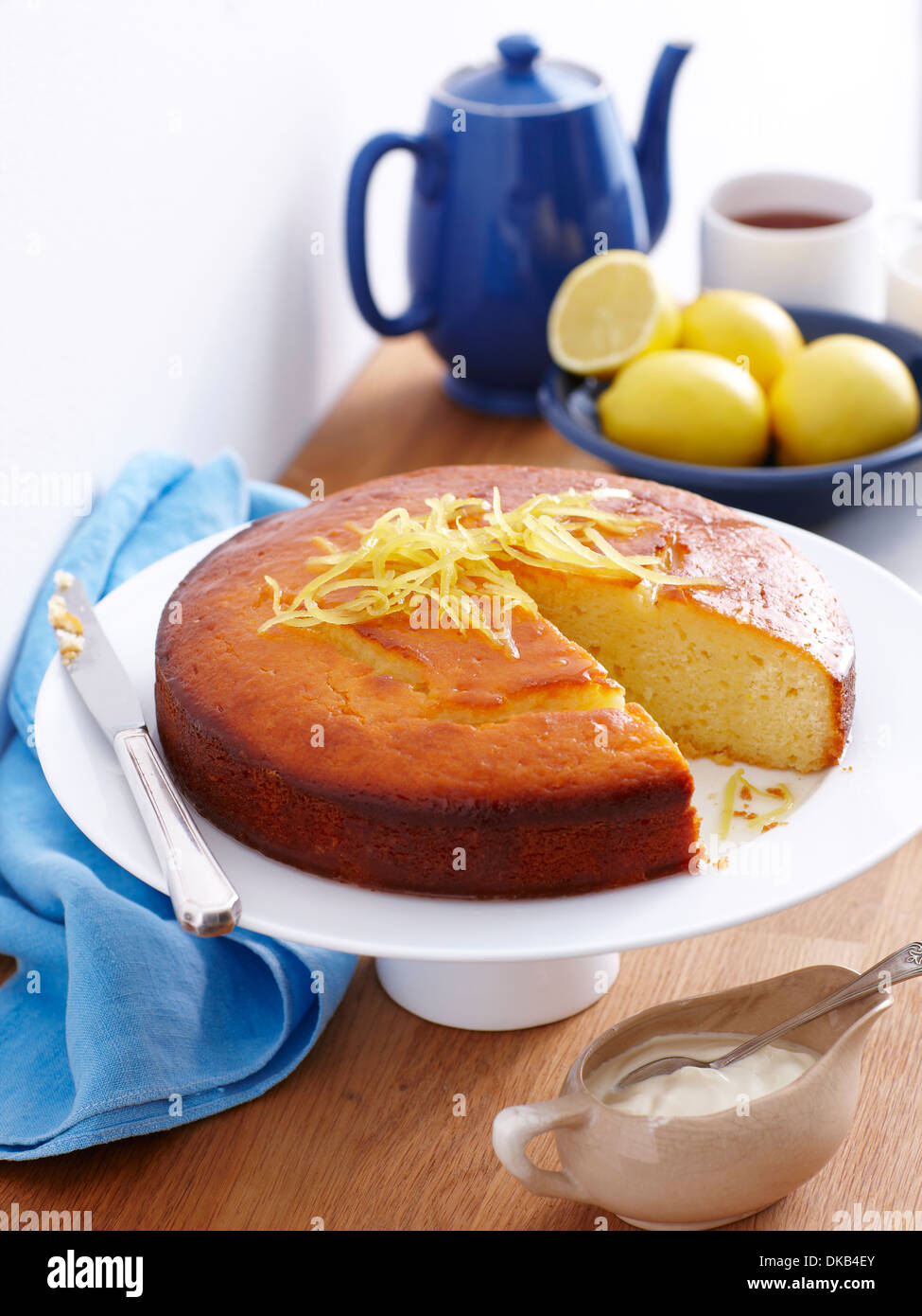 Still life of lemon yogurt cake with lemon rind garnish Stock Photo