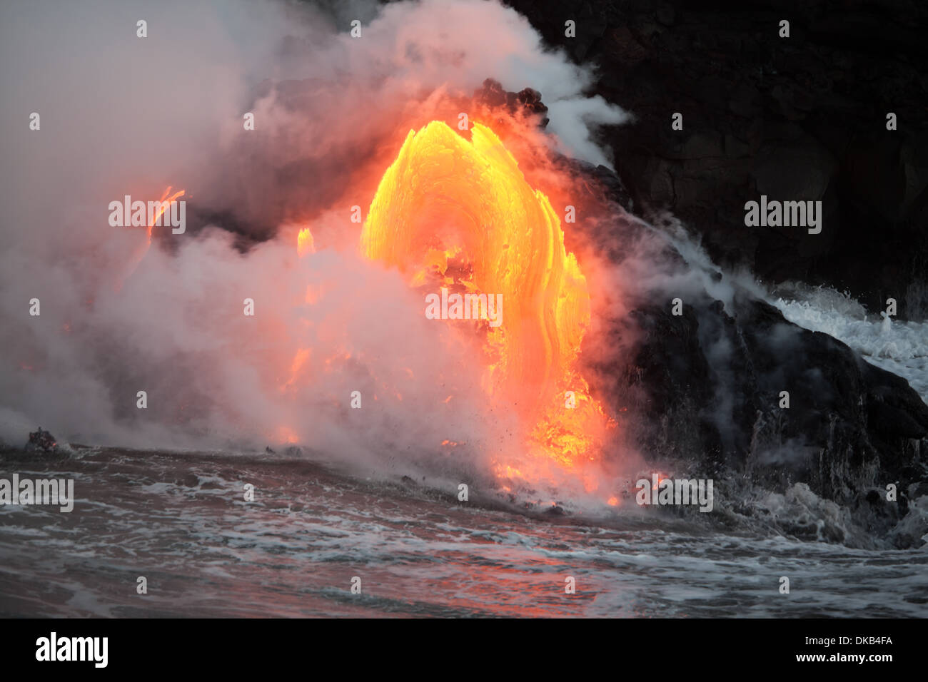 Hot lava stream is flowing into the ocean. Hawaii, Big Island. Stock Photo