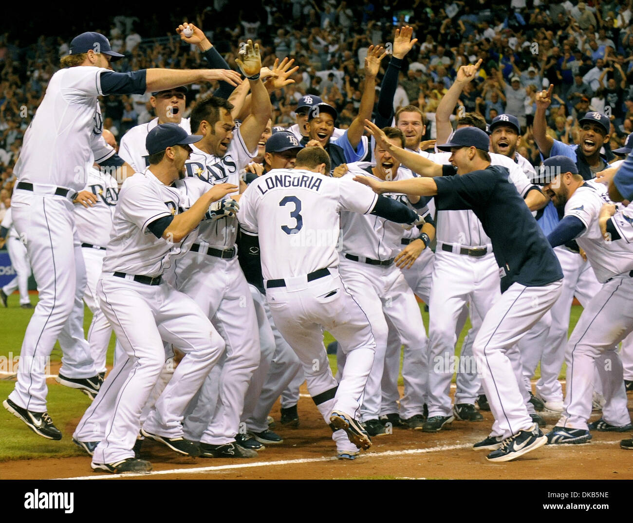 Sep. 29, 2011 - St. Petersburg, Florida, USA.The Tampa Bay Rays swarm Evan Longoria (3) following his 12th inning home run to beat the New York Yankees 8-7 and secure the American League wild card at a Major League Baseball game in St. Petersburg, Florida, USA  29 September 2011. (Credit Image: Brian Blanco/ZUMA Press) Stock Photo