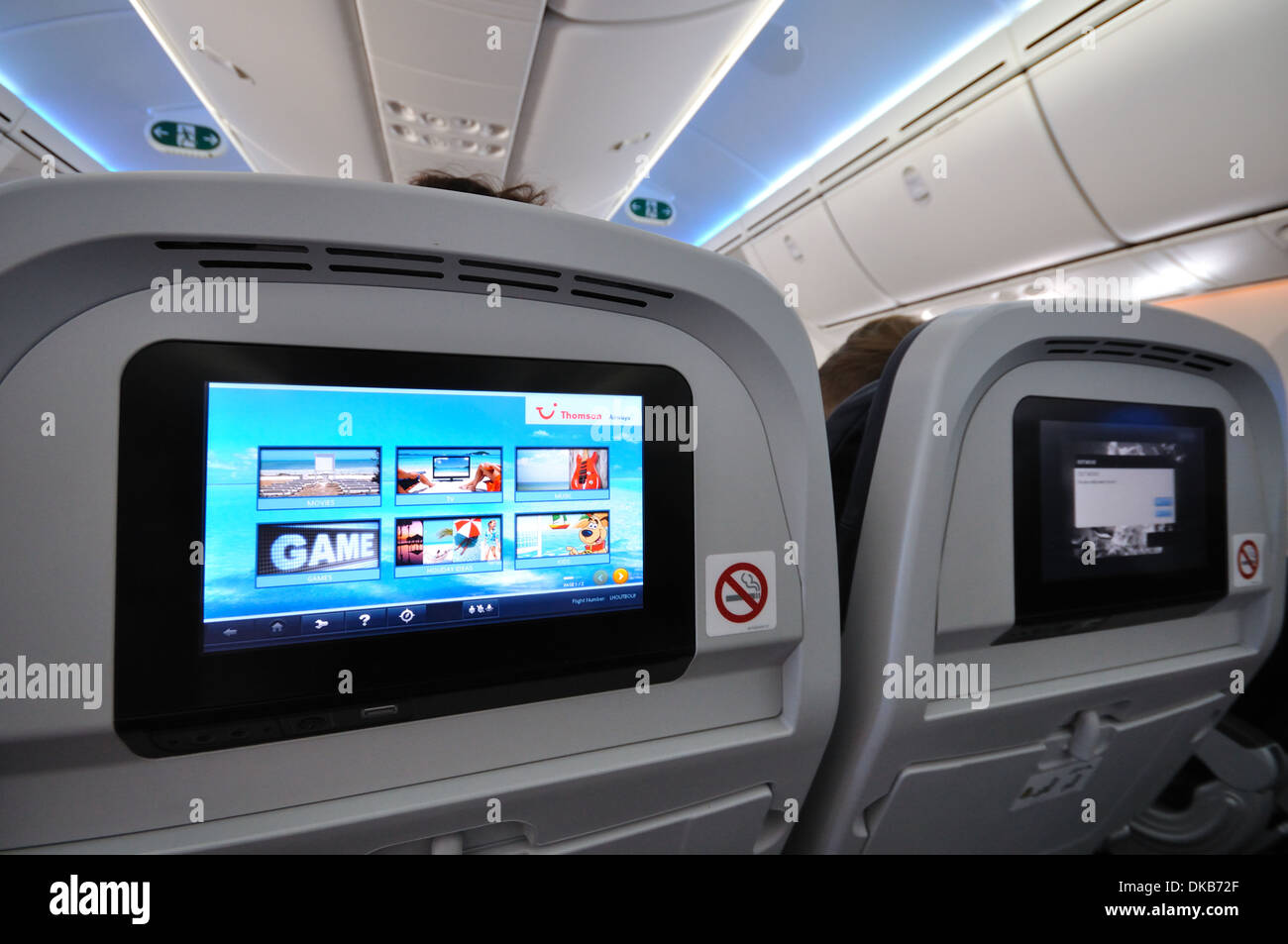 Seatback entertainment consoles on a Thomson Holidays 787 Dreamliner Stock Photo