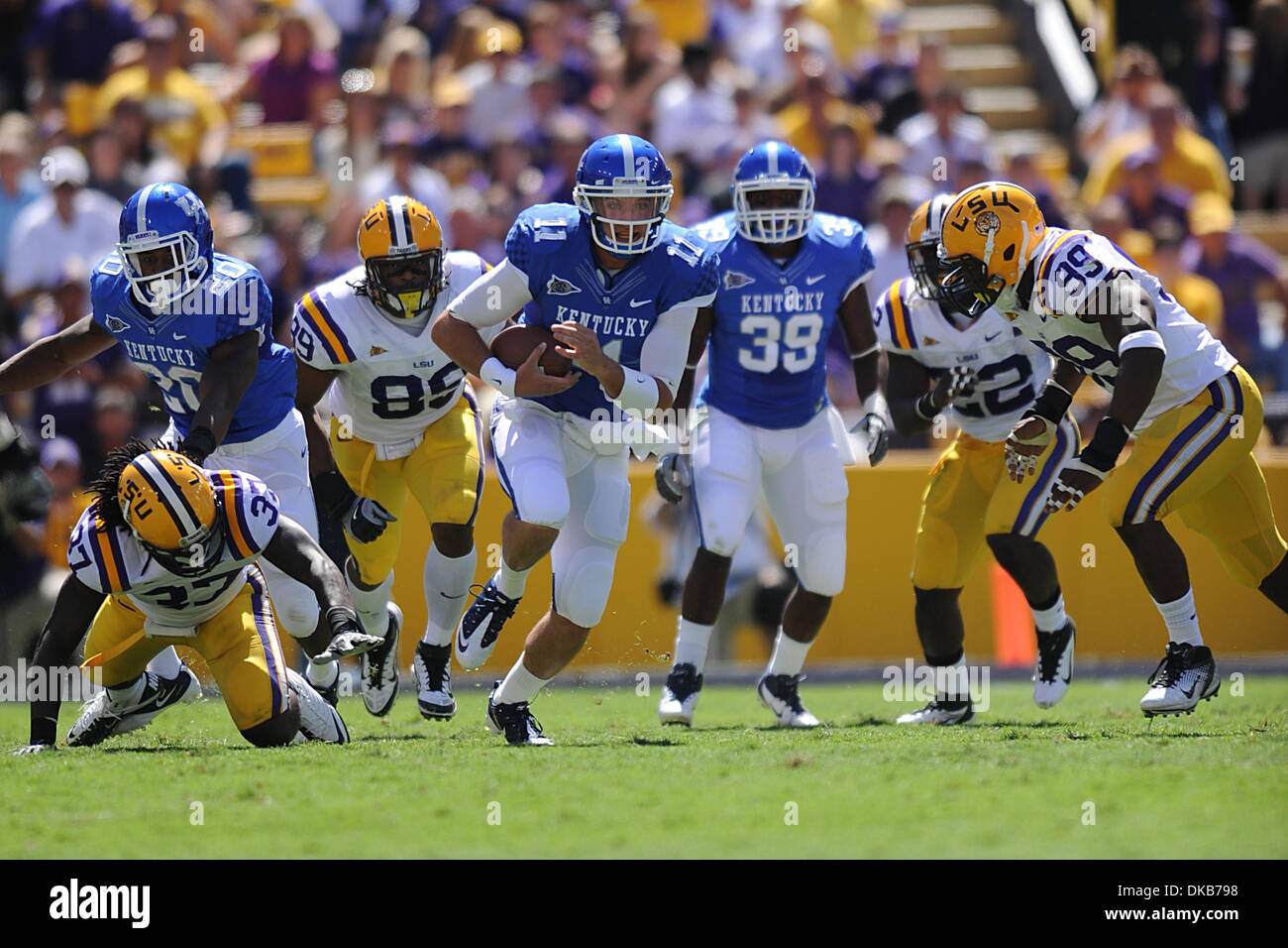 Kentucky Wildcats quarterback Maxwell Smith (11) runs with the ball in the  Div. 1 NCAA football game between the LSU Tigers and the Kentucky Wildcats  at Tiger Stadium in Baton Rouge, La.