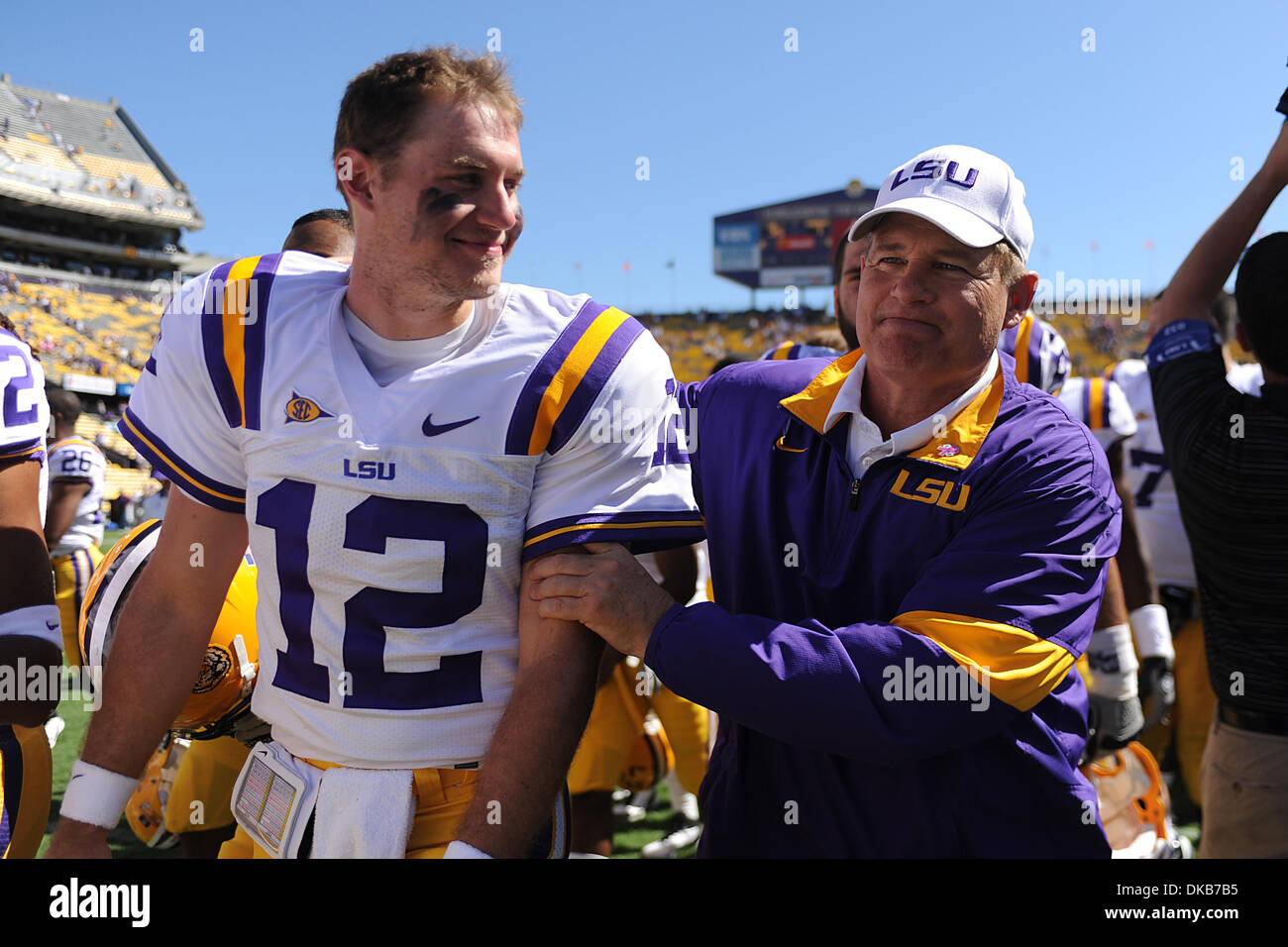 LSU Tigers head coach Les Miles celebrates with LSU Tigers quarterback