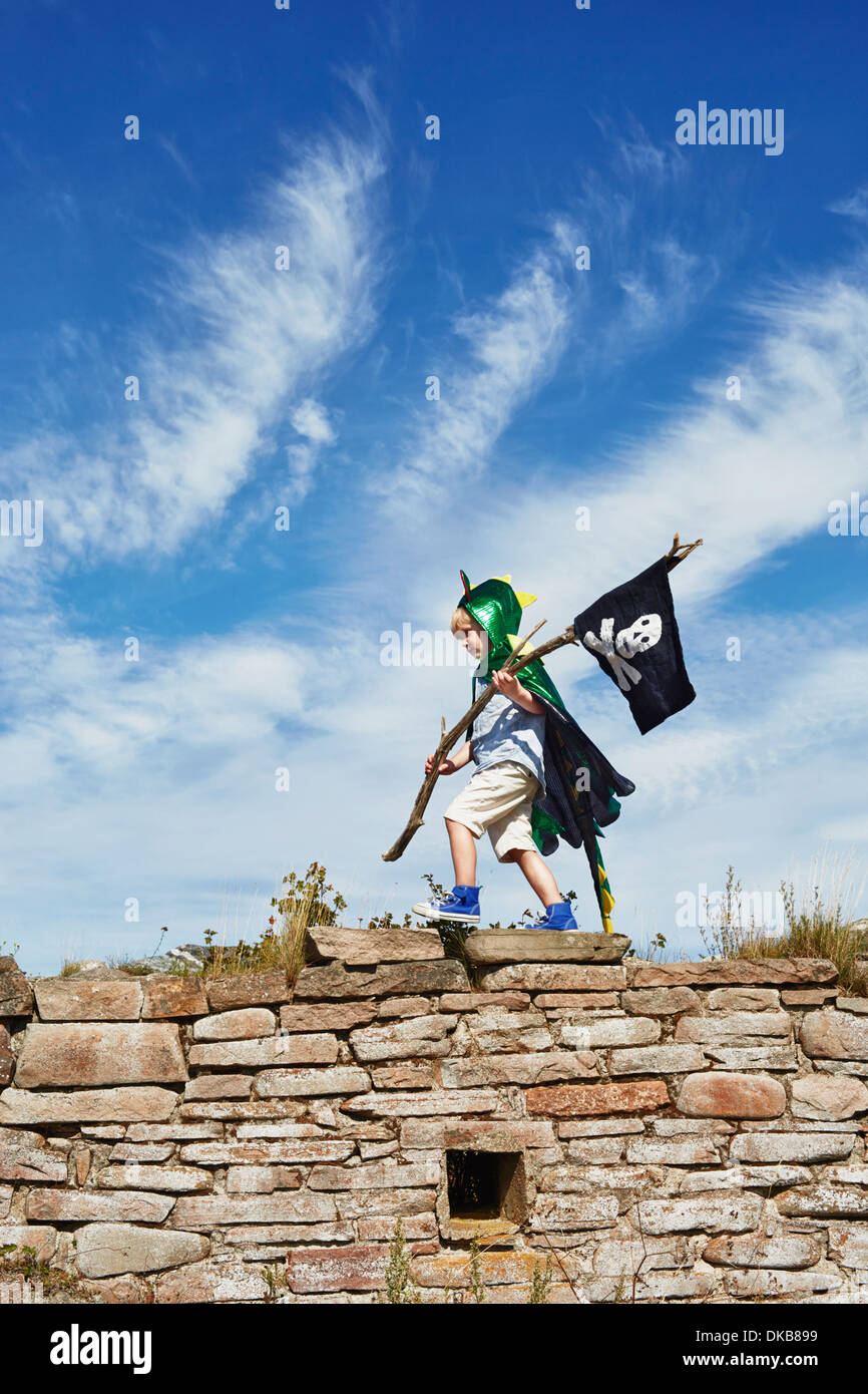 Boy carrying pirate flag, Eggergrund, Sweden Stock Photo