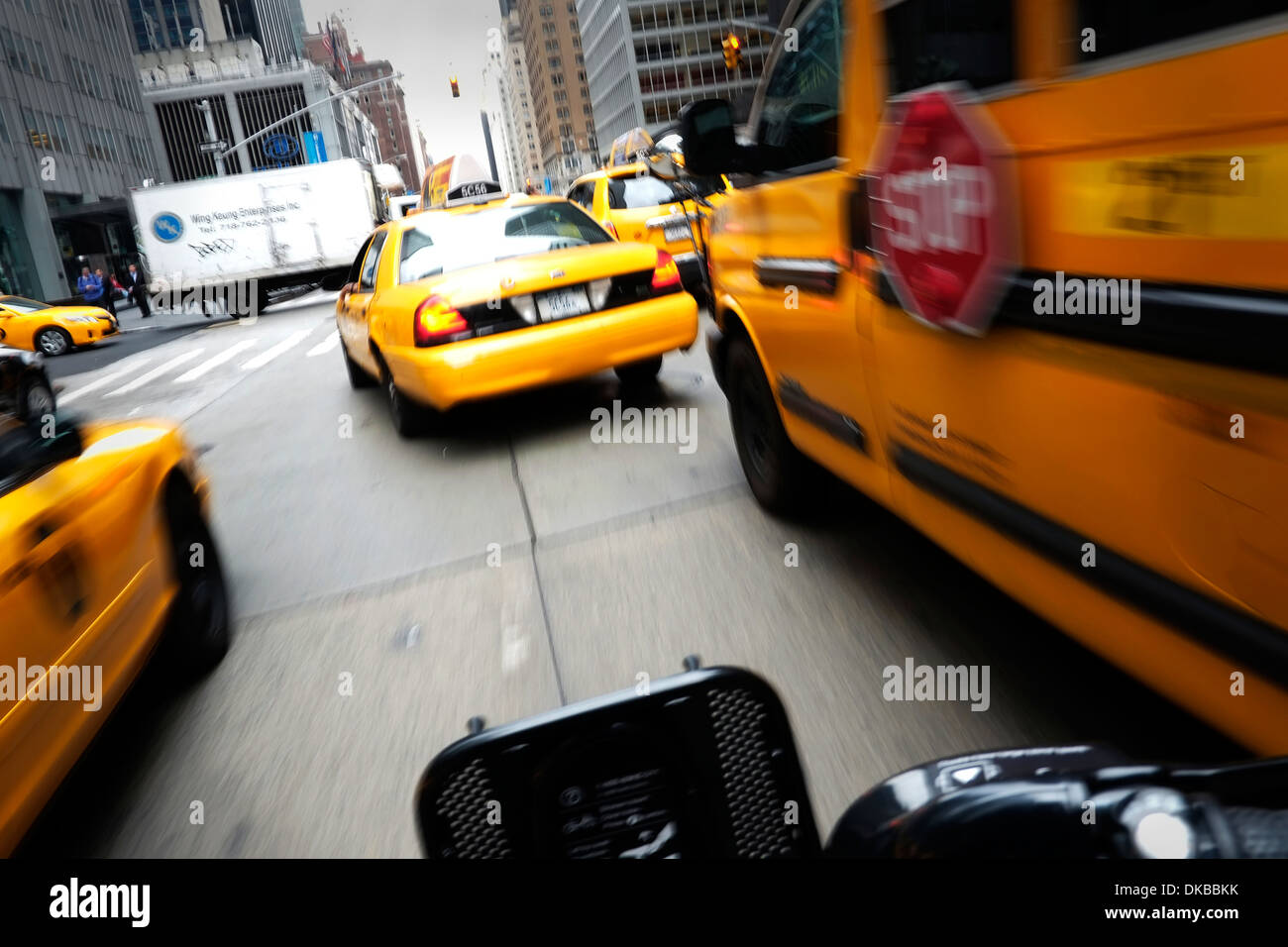 View from a moving bicycle as it passes through traffic on 6th Avenue in Midtown Manhattan, New York City. Stock Photo