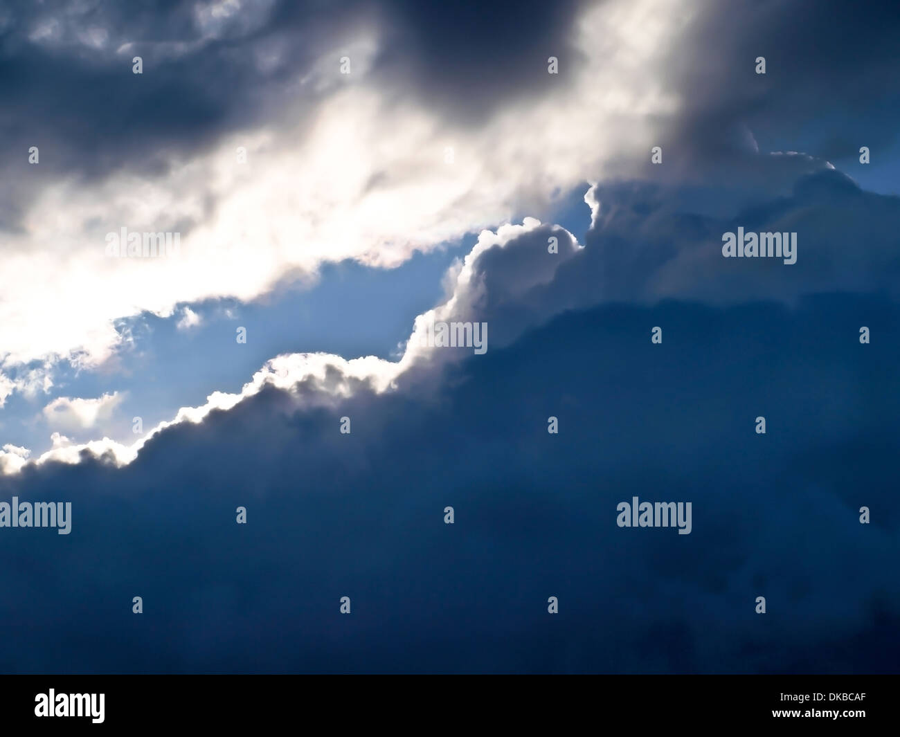 a part of sunny sky between storm clouds Stock Photo