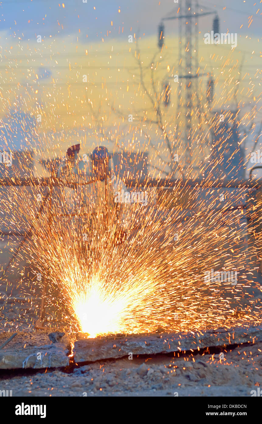 worker cut metal using blowtorch inside of plant Stock Photo Alamy
